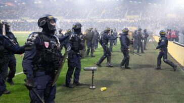 french-football-match-descends-into-chaos-as-furious-nantes-fans-breach-security,-storm-pitch