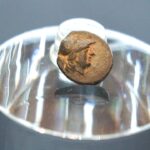 teen-stumbles-on-mysterious-coin-from-legendary-city,-puzzling-archaeologists-over-its-journey