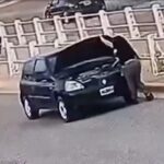 horrifying-moment-driver-run-over-by-her-own-car-while-checking-battery-—-and-miraculously-survives-unscathed