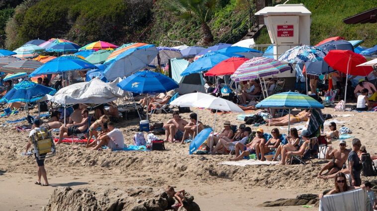 vacation-hot-spot-cracks-down-on-beach-setups-with-$500-fines-for-sun-shades,-canopies