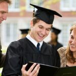 parents-help-graduate-sound-out-the-words-on-diploma