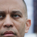 hakeem-jeffries-mocked-for-posting-‘bizarre’-facetuned-image-of-himself-in-knicks-hat