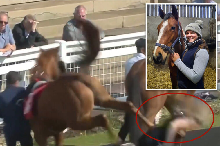 trainer-richard-fahey’s-assistant-gets-brutally-bucked-by-racehorse-—-and-sent-flying-over-the-track-wall