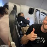 wild-video:-deranged-passenger-tries-to-jump-out-of-frontier-plane-mid-flight,-hero-former-pro-mma-fighter-wearing-jiu-jitsu-shirt-ties-him-up-with-seatbelts-and-saves-everyone