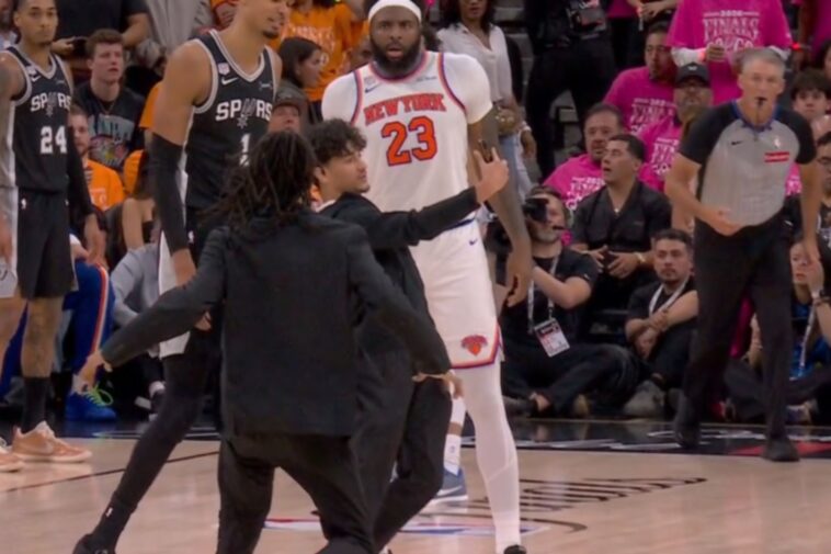 selfie-taking-fan-storms-court-in-surreal-nba-finals-game-1-scene