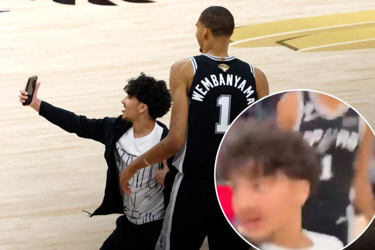 new-angle-shows-fan-storming-court-for-selfie-with-smiling-victor-wembanyama-in-knicks-spurs-nba-finals