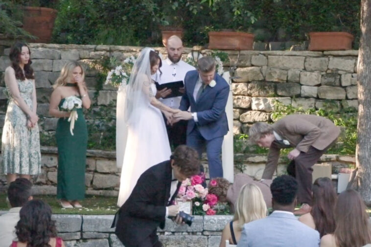 wild-video-shows-wedding-officiant-keep-ceremony-moving-even-after-best-man-hits-the-deck