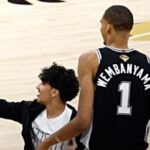 look-at-me!-rogue-selfie-hunting-fan-stops-game-1-of-nba-finals-for-shot-with-victor-wembanyama