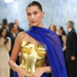 hailey-bieber-shows-off-toned-abs-in-behind-the-scenes-photos-from-new-rhode-beach-campaign