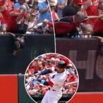 reds-fan-holds-kid-by-legs-in-effort-to-get-home-run-ball-in-wild-scene:-‘going-to-sacrifice-his-son’