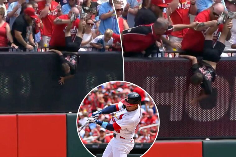reds-fan-holds-kid-by-legs-in-effort-to-get-home-run-ball-in-wild-scene:-‘going-to-sacrifice-his-son’