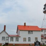 two-ladies,-a-dog,-a-lighthouse-and-a-possible-bigfoot-encounter-on-a-beach-in-michigan