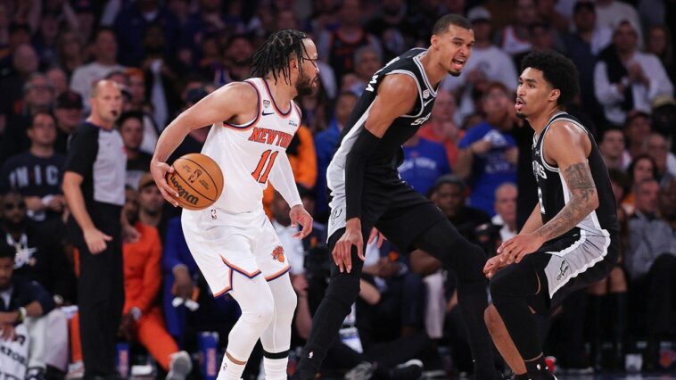 victor-wembanyama-puts-hand-on-jalen-brunson’s-head,-pushes-him-down-as-refs-look-the-other-way-in-game-3