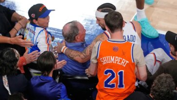 knicks-guard-nearly-wipes-out-michael-bloomberg-diving-for-loose-ball-during-nba-finals-game-3
