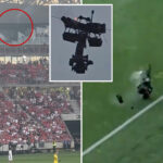 camera-catches-fire-and-falls-at-soccer-match-—-as-operator-narrowly-avoids-disaster