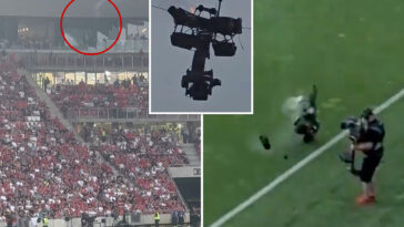 camera-catches-fire-and-falls-at-soccer-match-—-as-operator-narrowly-avoids-disaster
