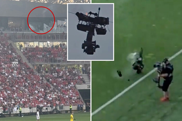 camera-catches-fire-and-falls-at-soccer-match-—-as-operator-narrowly-avoids-disaster