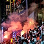 watch-—-times-square:-knicks-fans-torch-school-buses,-light-fireworks-after-nba-win