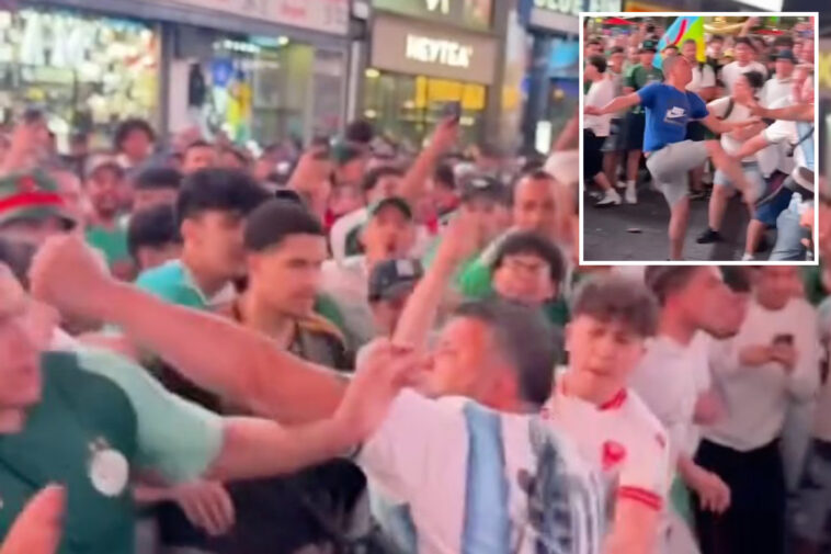 brawl-erupts-between-mob-of-argentinian-and-algerian-soccer-fans-in times-square-ahead-of-world-cup-showdown