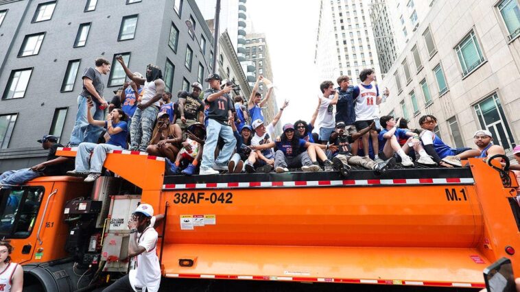 knicks-fans-climb-on-police-cars,-sanitation-trucks-as-countless-others-unable-to-get-into-jam-packed-parade