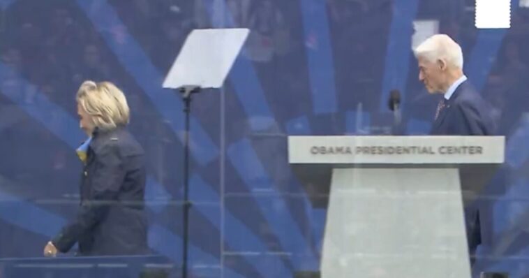 is-hillary-hiding-something-again?-hillary-clinton-bundles-up-in-warm-june-weather-at-obama-library-opening-ceremony-–-what-is-that-back-bulge?-(video)