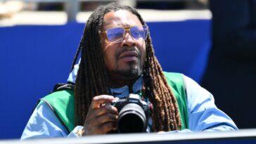 marshawn-lynch-works-as-photographer-for-usa-vs-australia-match