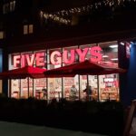 watch:-mob-of-“youths”-takes-over-five-guys-in-new-york-after-nba-finals-game-4,-jump-counter-and-launch-chairs-in-violent-attack-on-employee