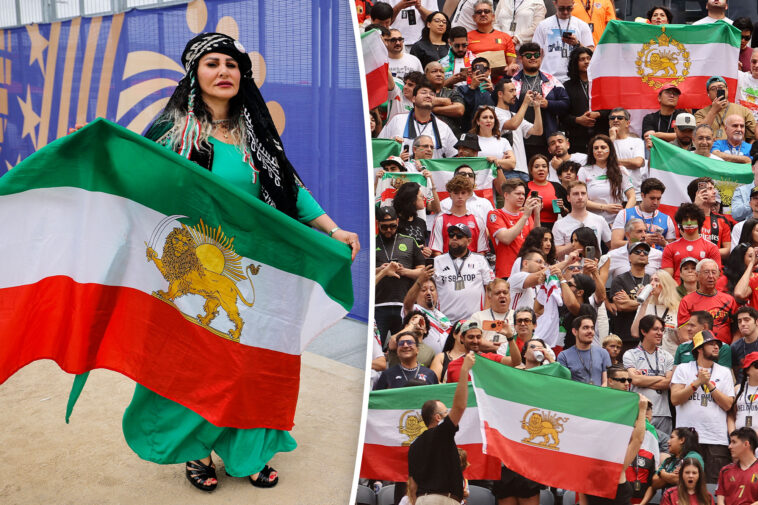 iranian-fans-defy-fifa-ban-again-as-forbidden-flags-flood-stadium-during-world-cup-clash-with-belgium