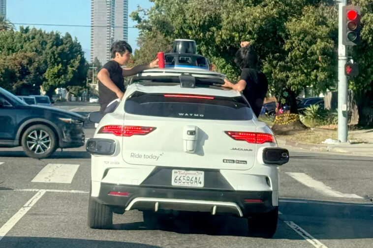 wild-moment-teenagers-and-a-nine-year-old-hang-out-of-fast-moving-waymo-in-santa-monica