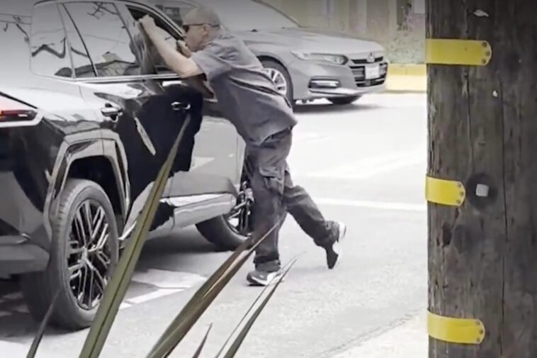 angry-man-seen-dangling-off-the-side-of-car-in-san-francisco-road-rage-incident:-‘he’s-running-him-over’