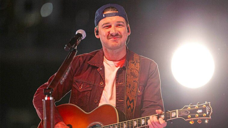 country-star-morgan-wallen-showcases-christian-faith-with-bible-verse-on-cast-during-concert