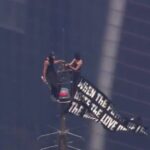 developing:-masked-couple-climbs-the-empire-state-building,-unfurl-banner…-marriage-proposal?-(video)