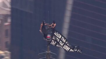 developing:-masked-couple-climbs-the-empire-state-building,-unfurl-banner…-marriage-proposal?-(video)