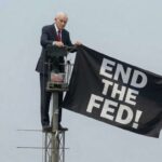 ron-paul-scales-empire-state-building-to-unveil-flag-reading-‘end-the-fed!’