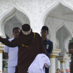 watch-—-sharia-law:-indonesian-woman-collapses-during-flogging-for-kissing-partner-on-tiktok