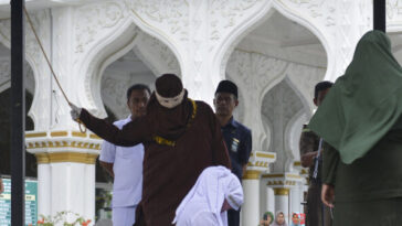 watch-—-sharia-law:-indonesian-woman-collapses-during-flogging-for-kissing-partner-on-tiktok