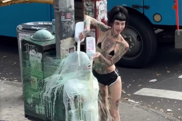 brooklyn-dominatrix-saran-wraps-sub-to-street-pole,-douses-him-in-milk