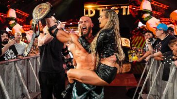 wwe’s-maxxine-dupri-helps-austin-theory-and-bron-breakker-win-world-tag-team-championship,-seals-win-with-kiss