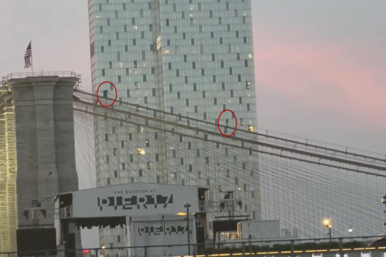 daredevil-strolls-across-brooklyn-bridge-suspension-cables,-closing-historic-span,-wild-video-shows