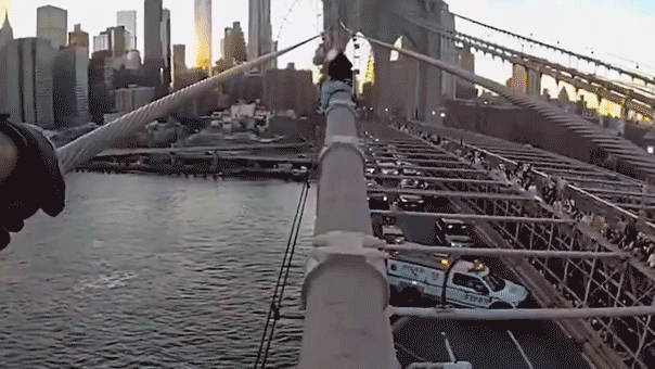 dramatic-bodycam-video-captures-nypd-officer-rescuing-woman-from-top-of-brooklyn-bridge-after-emotional-plea