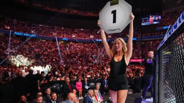 sophie-cunningham-kicks-off-her-shoes-and-walks-the-octagon-at-ufc-329-as-a-surprise-ring-girl