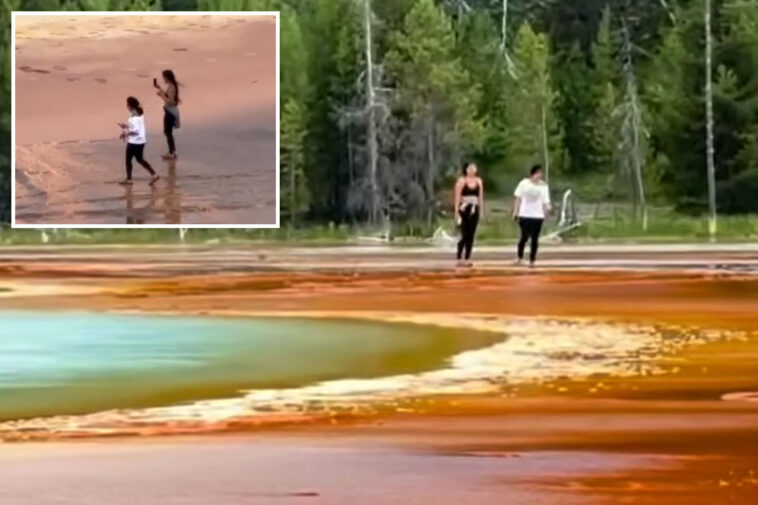 clueless-yellowstone-visitors-spark-outrage-after-trampling-over-park’s-famous-natural-landmark