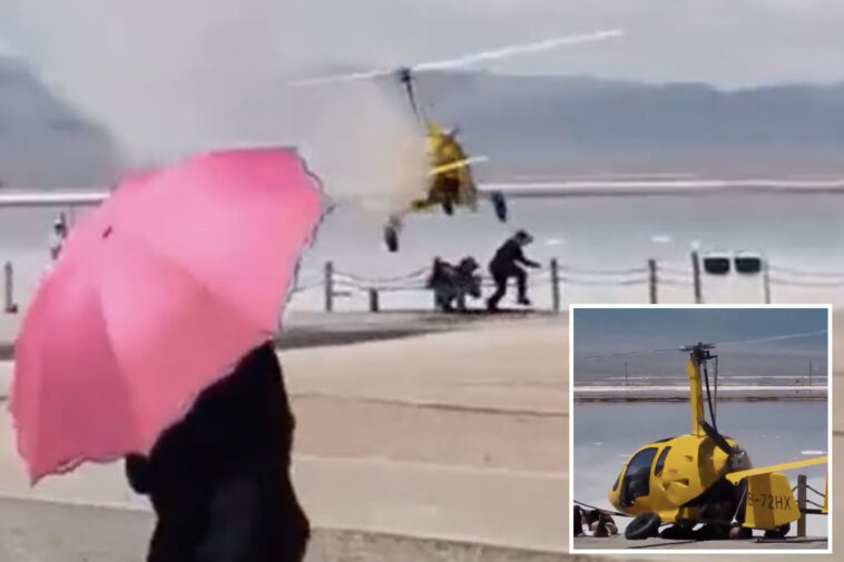 terrifying-video-shows-helicopter-crash-landing-on-two-tourists