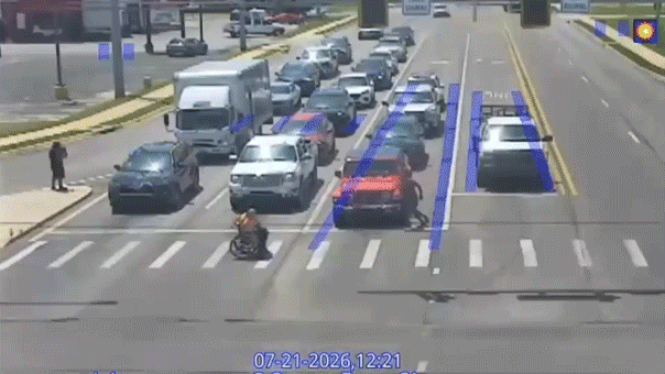 good-samaritan-in-spider-man-costume-helps-man-in-wheelchair-cross-busy-intersection-in-viral-moment