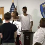 watch-how-police-react-as-screaming-protester-takes-over-briefing-on-fatal-shooting