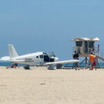 small-plane-makes-emergency-landing-on-sand,-stunning-beachgoers-at-huntington-state-beach
