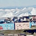 insane-footage-shows-giant-iceberg-collapsing-in-front-of-greenland-settlement,-sending-tsunami-like-waves-towards-the-shore