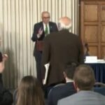 watch:-“please-sit-down!”-–-schumer’s-anti-trump-speech-interrupted-by-liberal-heckler-screaming,-“how-dare-you-talk-about-corruption…-genocidal-maniac.-shame!”