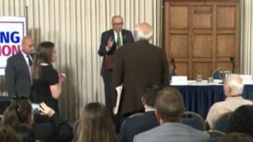 watch:-“please-sit-down!”-–-schumer’s-anti-trump-speech-interrupted-by-liberal-heckler-screaming,-“how-dare-you-talk-about-corruption…-genocidal-maniac.-shame!”