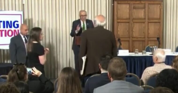 watch:-“please-sit-down!”-–-schumer’s-anti-trump-speech-interrupted-by-liberal-heckler-screaming,-“how-dare-you-talk-about-corruption…-genocidal-maniac.-shame!”